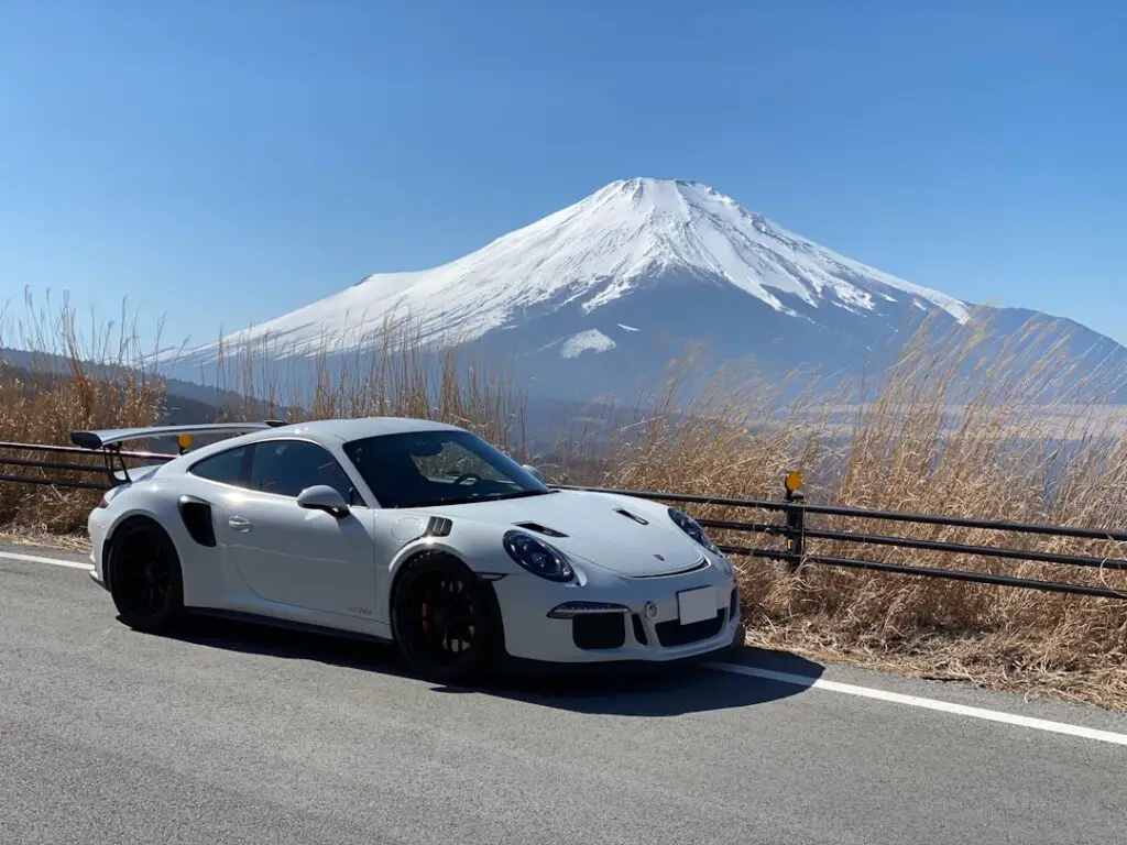car beside a mountain